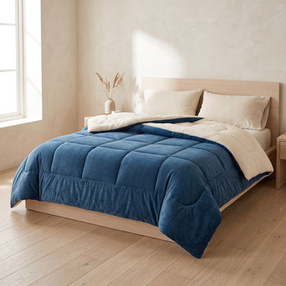 Nordic Cloud winter quilt in plain Ocean Blue on a bed in a Scandinavian bedroom